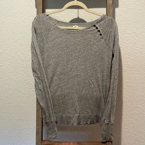 Long-sleeve grey cotton shirt.
